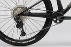 NUEVA: Norco Revolver C2 120, aro 29 2026 | Fast Black Raw Carbon / Golden Larch