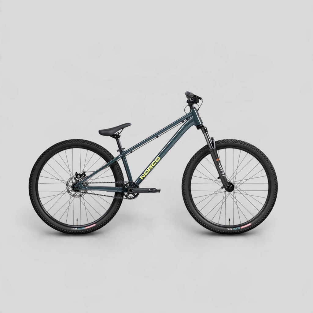Bicicleta de dirt jump MZ Bikes Norco Rampage 2 en color gris azulado con cuadro de aluminio y horquilla RST Dirt