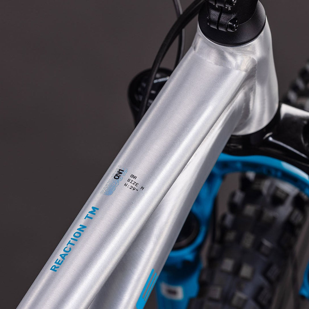 BICICLETA CUBE REACTION TM ONE RAWMETAL´N´BLUE